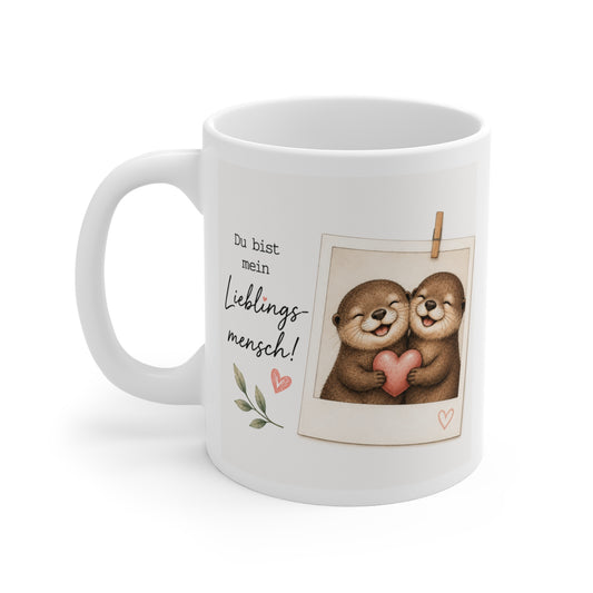 Weiße Keramiktasse mit liebevollem Otter-Pärchen, Herz und dem Spruch „Du bist mein Lieblingsmensch“