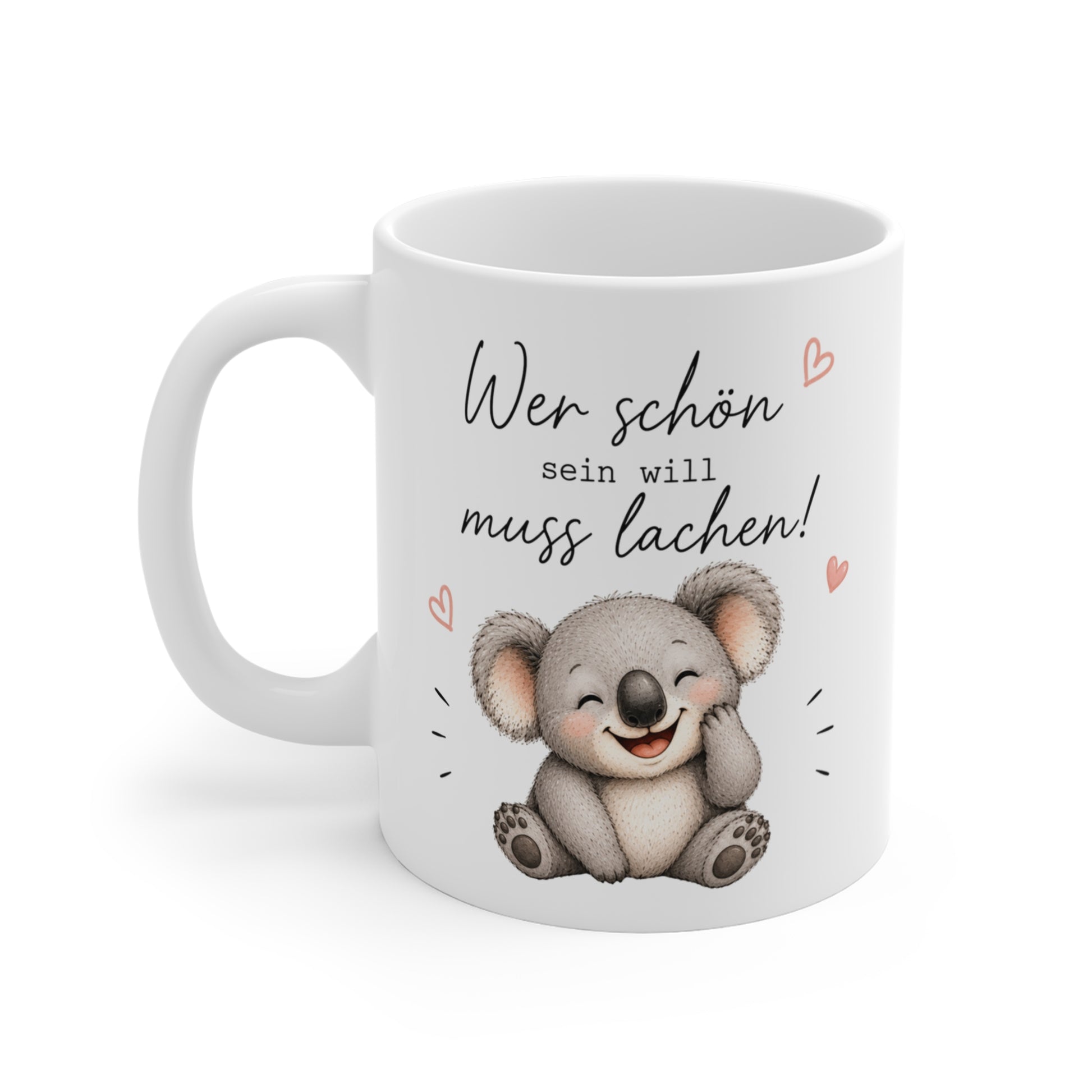 Weiße Keramiktasse mit lachendem Koala und dem Spruch „Wer schön sein will muss lachen“