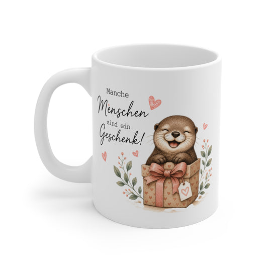 Weiße Keramiktasse mit lächelndem Otter im Geschenkpaket, Herzsymbolen und wertschätzender Botschaft