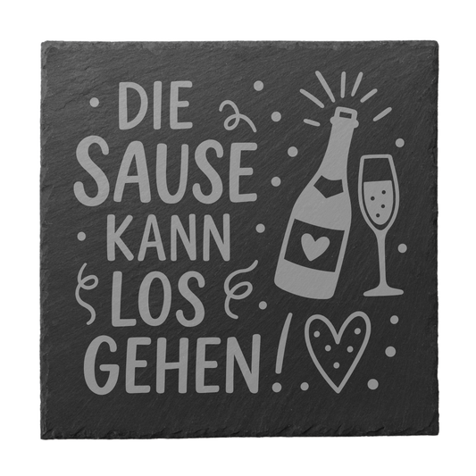 Quadratischer schwarzer Schiefer-Untersetzer mit Gravur „Die Sause kann losgehen!“ und Prosecco-Flasche