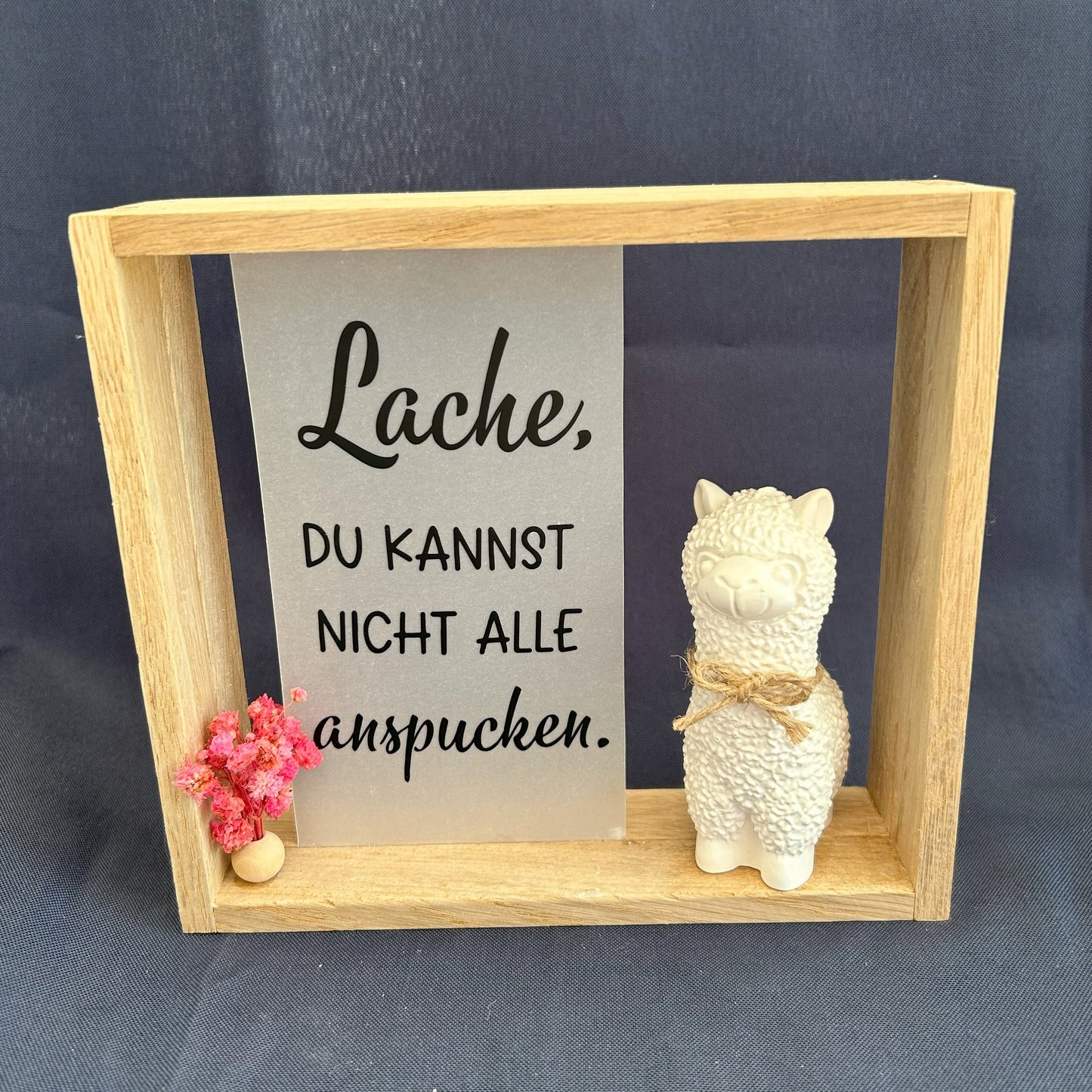 Holzrahmen - „Lache, du kannst nicht alle anspucken“