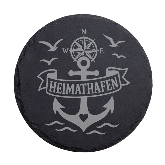 Runder schwarzer Schiefer-Untersetzer mit Heimathafen-Schriftzug und maritimem Anker-Design