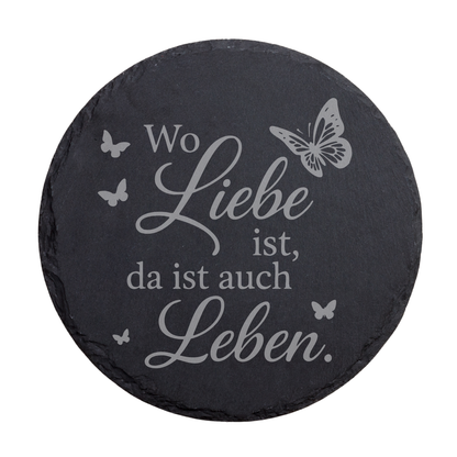 Runder schwarzer Schiefer-Untersetzer mit romantischem Spruch „Wo Liebe ist, da ist auch Leben“